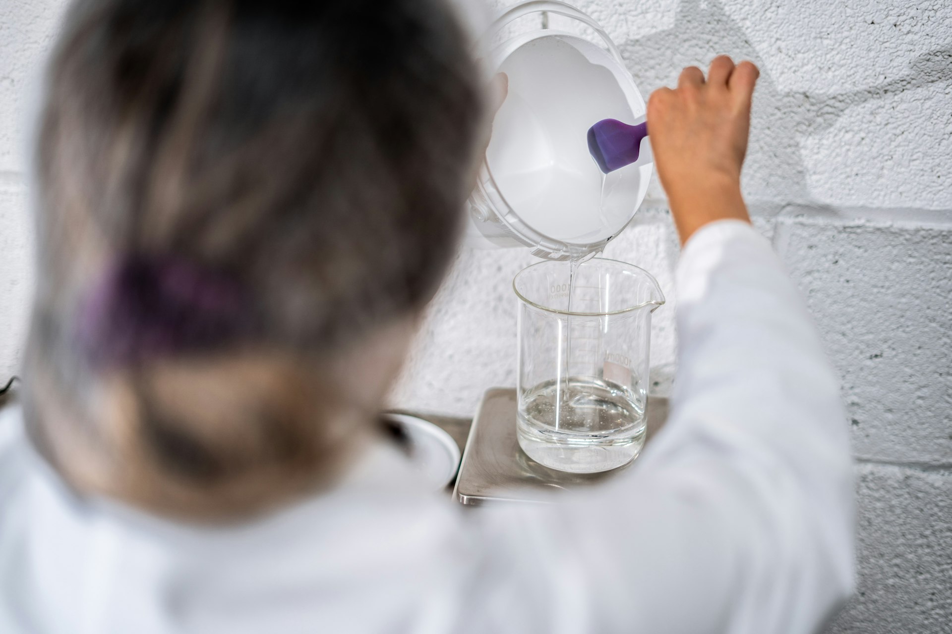 a person holding a beaker